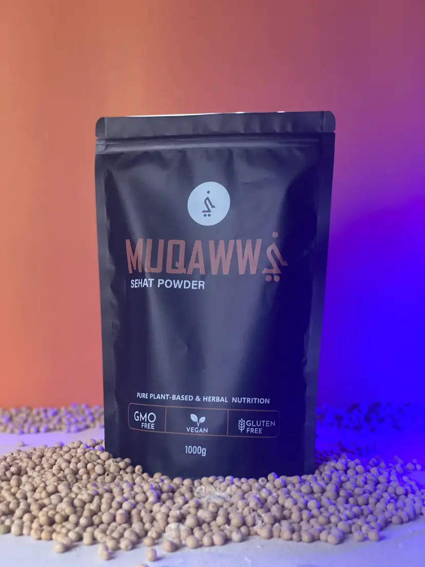 Muqawwi Sehat Powder pouch on a bed of legumes, orange to violet light